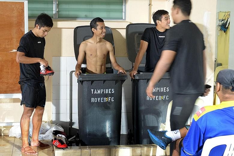 Tampines Rovers players Ismadi Mukhtar (centre) and Hafiz Sujad (right) staying ice cool amid the club's cashflow woes. The duo were having ice baths to aid recovery after training at Jurong West Stadium on Thursday. Tampines also played midweek in t