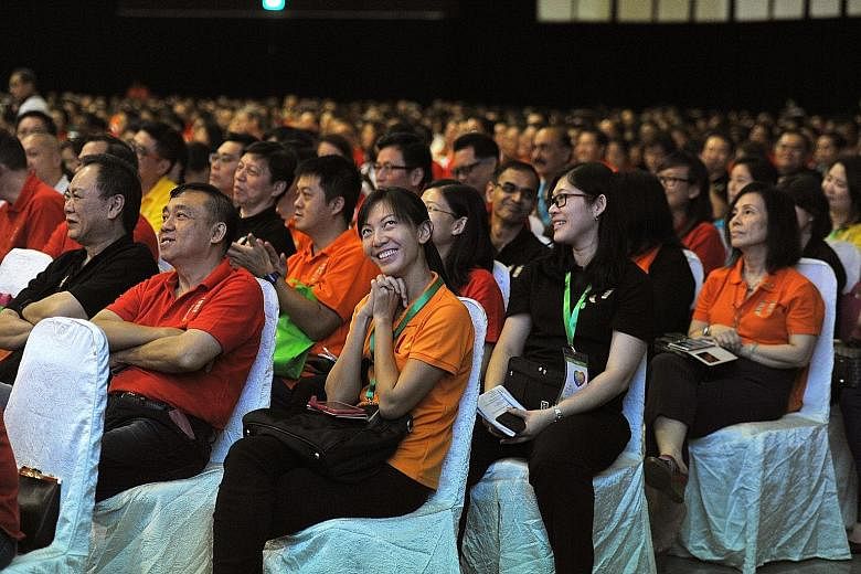 The audience at the May Day Rally held at D'Marquee, Downtown East yesterday. PM Lee said the Government's approach is to ensure a more level playing field and help industries and firms compete better.