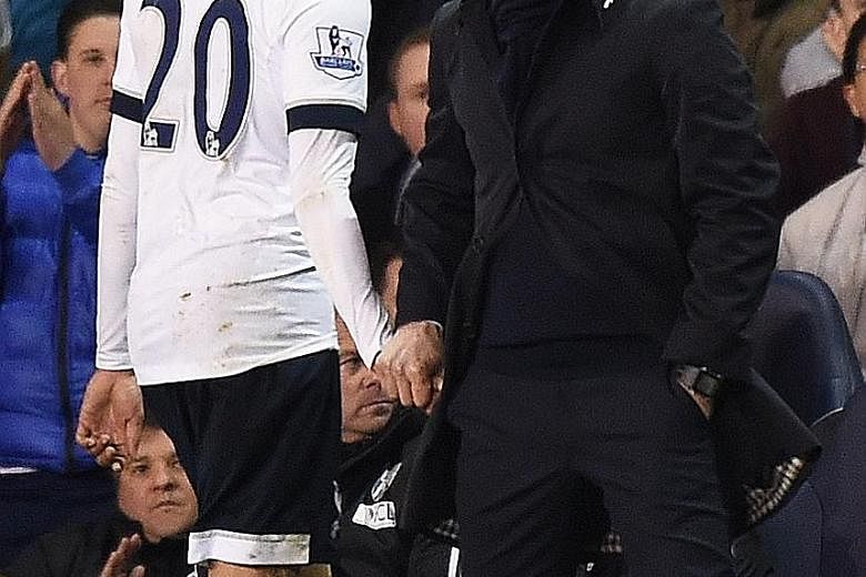 Tottenham's Dele Alli walks off after being substituted against West Brom on April 25 as manager Mauricio Pochettino looks on. The midfielder faces a three-game ban and will not feature in the clash against Chelsea.