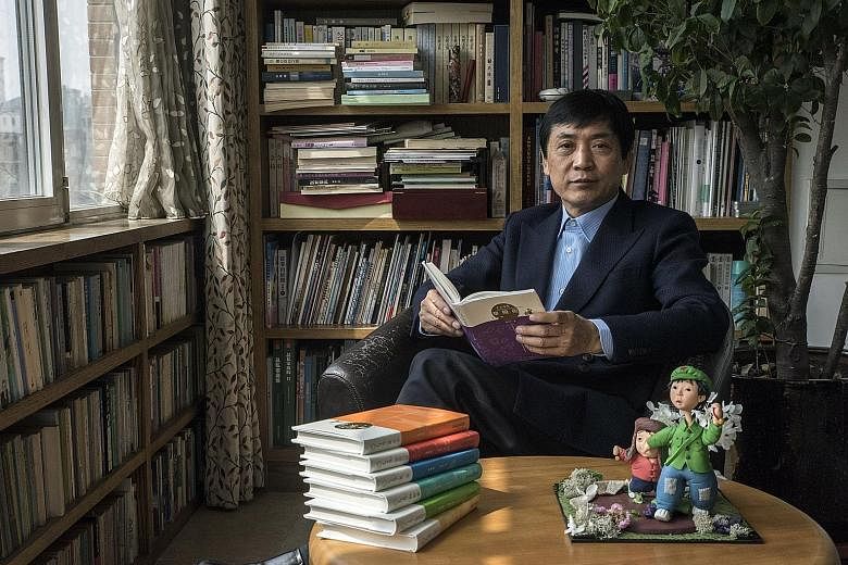 Author Cao Wenxuan at his home in Beijing. In the foreground are figurines of his novels' characters.
