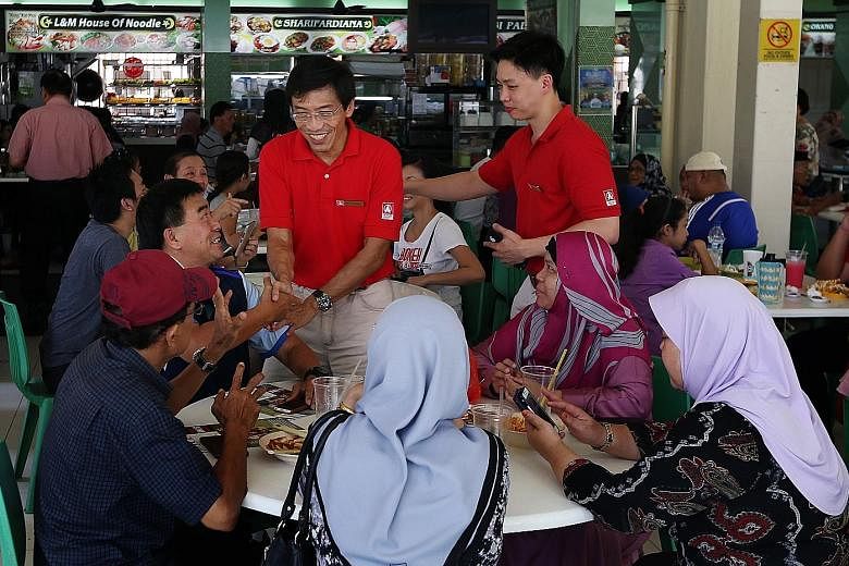 Dr Chee greeting people in Bukit Batok during a walkabout yesterday. Speaking to reporters after an event in the constituency, he reiterated his view that it is impossible for an MP to hold a full-time job and still discharge his responsibilities ful