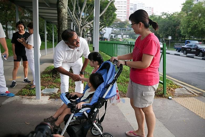 Mr Murali on a walkabout in Bukit Batok West Avenue 6 yesterday. The PAP candidate for the Bukit Batok by-election says he is seeking to build up a pool of volunteers who can help unlock students' potential.