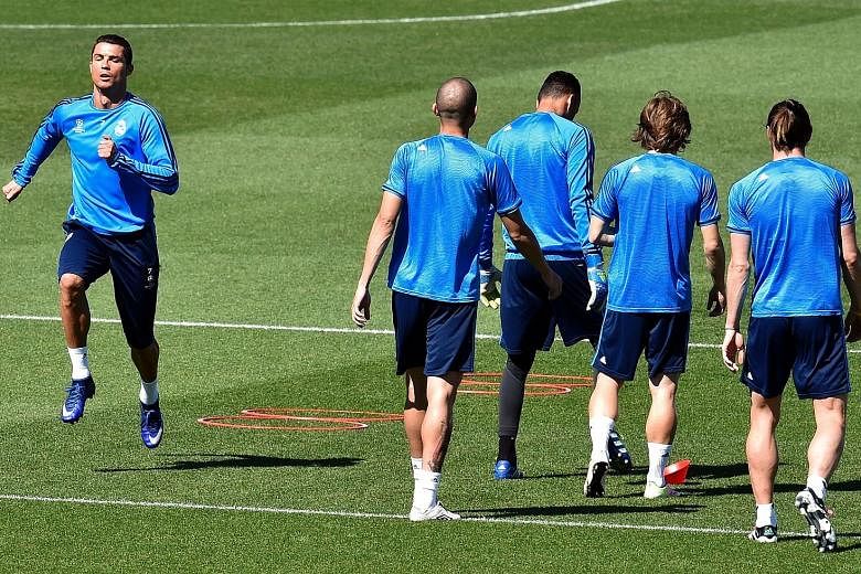 Cristiano Ronaldo (far left) training with his Real Madrid team-mates ahead of the Champions League semi-final, second-leg clash with Manchester City at the Santiago Bernabeu. The first leg ended in a 0-0 draw.