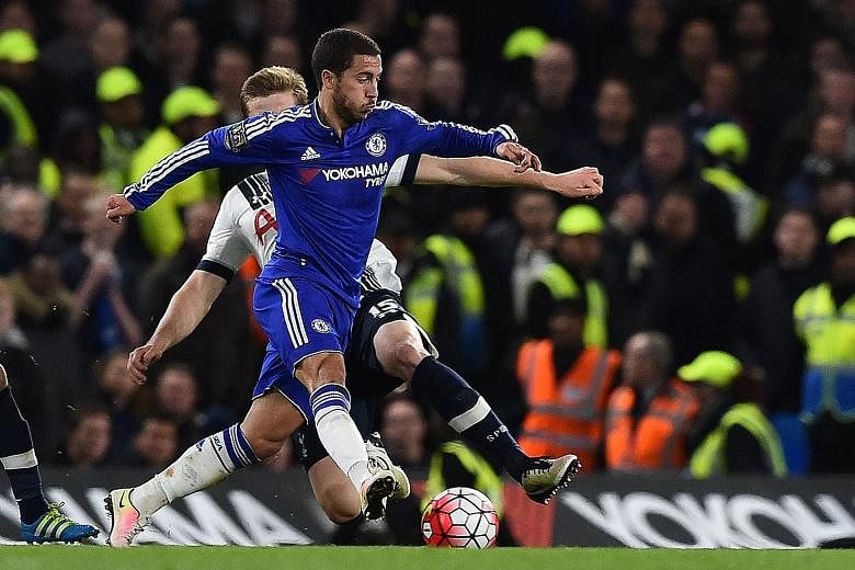 Spurs' Eric Dier (back) fouls Chelsea's Eden Hazard during the ill-tempered game at Stamford Bridge. The match ended with 12 players booked.