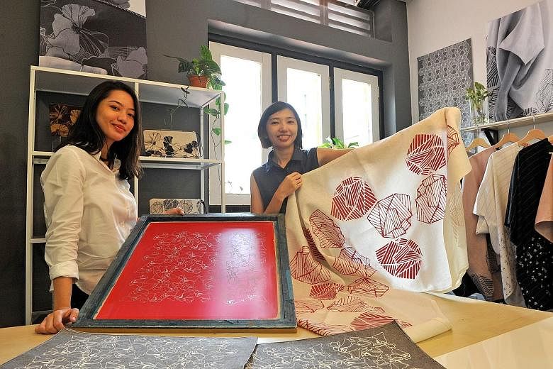 Sisters Aisah (left) and Hani Dalduri started their handprinted textile design studio Fictive Fingers as a hobby, selling their handmade crafts online. They still sell their products online but now the business is run primarily as a design studio whi