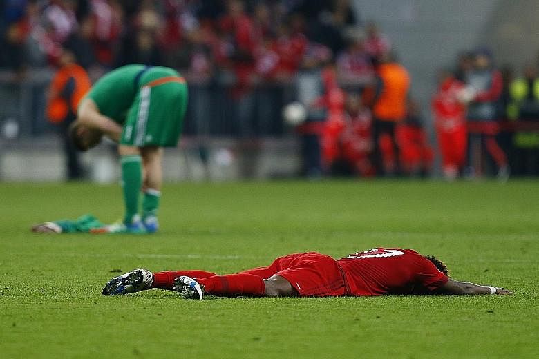 Bayern's David Alaba, like his team, is spent after they were knocked out by Atletico Madrid on away goals, exiting the competition at the semi-final stage for the third time in a row.