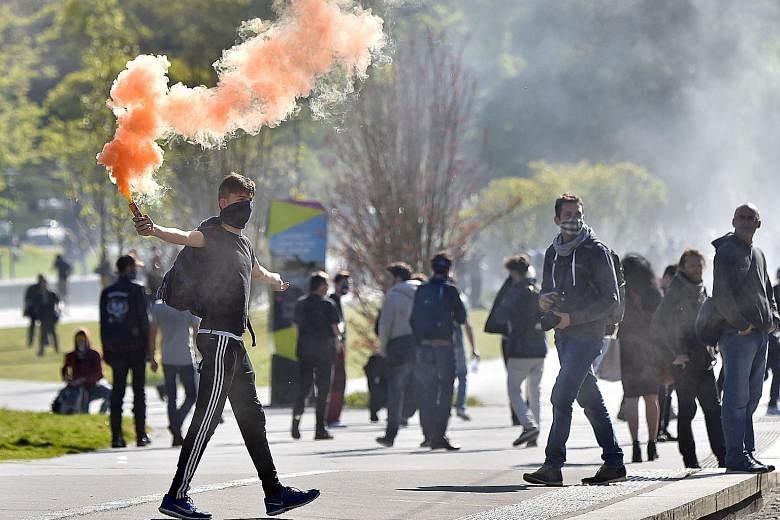 French workers and students protesting in the western city of Nantes on Tuesday against the Socialist government's planned labour law reforms. The proposals have divided the government and raised hackles in a country where the people are accustomed t