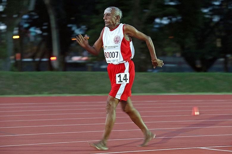Competing without footwear, T. D. Rajendran, the 80-year-old managing director of a herb company in Tamil Nadu, India, on his way to winning the 5,000m race walk in the men's 80-84 category at the Asia Masters Athletics Championships at Kallang yeste