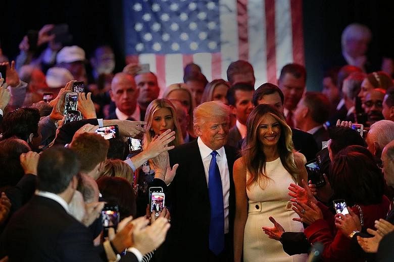 US Republican presidential candidate Donald Trump and his wife Melania arriving to speak to supporters at Trump Tower in Manhattan following his victory in the Indiana primary on Tuesday. Mr Trump beat Mr Cruz 53 per cent to 37 per cent, forcing the 