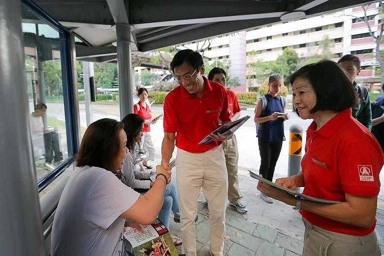 Dr Chee on his walkabout in Bukit Batok yesterday. This is his pitch to residents: Vote him into Parliament and he will hold the Government to account.