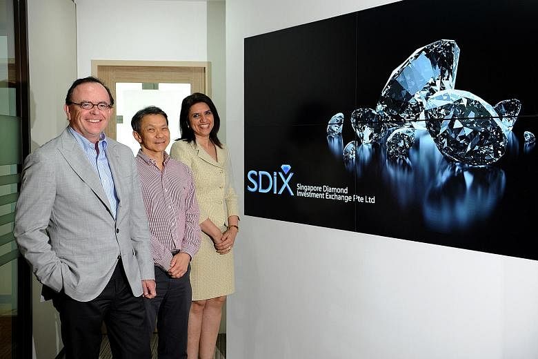 With SDiX, the highest bid price and the lowest selling price will be shown in real time. The prices of trades will also be reported. The exchange's founding team includes (from left) Mr Vandenborre, Mr Koh and chief operating officer Latika Kundu.