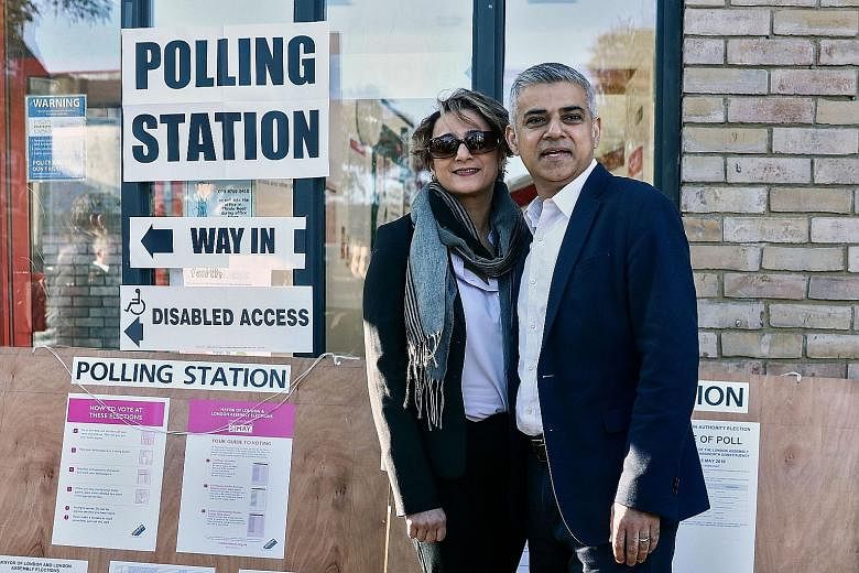 Mr Sadiq Khan, the Labour Party candidate for London mayor, and his wife Saadiya Khan after casting their votes yesterday.