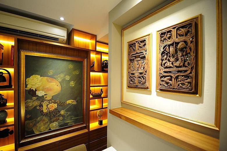 A painting by Chinese artist Liu Jianhua and a wood carving (both above) from Anhui province in China.