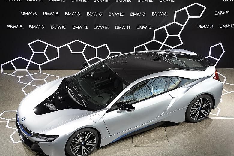 BMW is developing a roadster version of its hybrid i8 supercar (above).