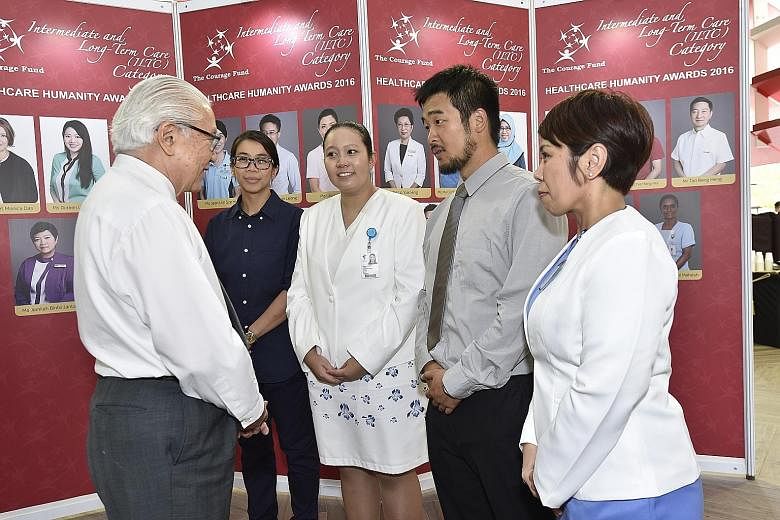 Among those who received awards from President Tony Tan Keng Yam were staff nurse Ms Wong Li Wai (left), who tended to Ebola patients in Sierra Leone, and Dr Lim Chin Siah (second from right), who volunteered with Medecins Sans Frontieres in Afghanis