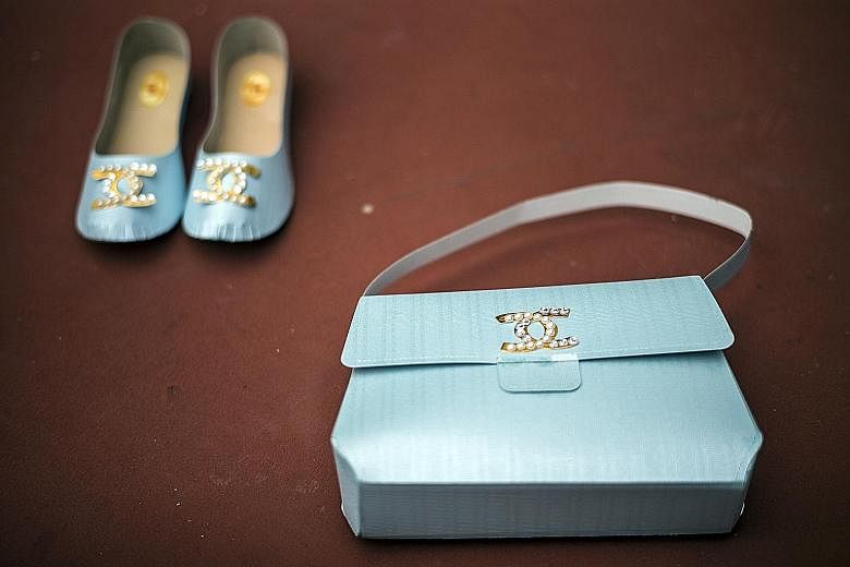 Paper replicas of luxury goods to be burnt as offerings for the deceased in Hong Kong.