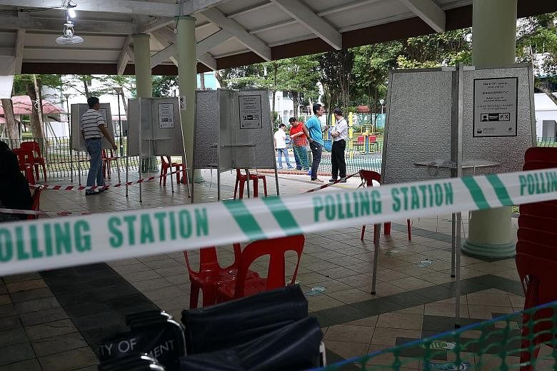 Barricades and voting booths at the polling station at the void deck of Block 105A, Bukit Batok Central, yesterday, ahead of Polling Day today. Voters can cast their ballots from 8am to 8pm.
