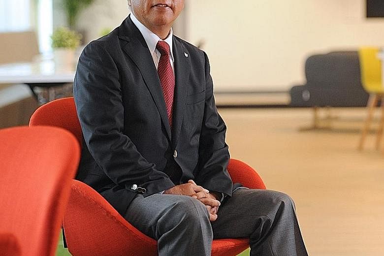 Canon Singapore president and chief executive Kensaku Konishi says switching to a portable medical benefits scheme for staff will incur costs in the transition period but, in the long run, the scheme will help to stabilise insurance costs for the fir