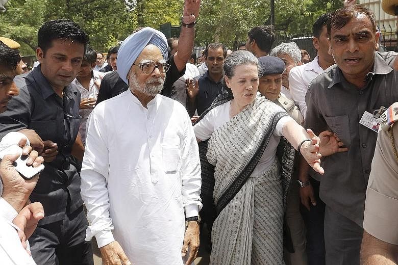 Congress party president Sonia Gandhi and former Indian prime minister Manmohan Singh (far left) leading the Save Democracy March in New Delhi yesterday.