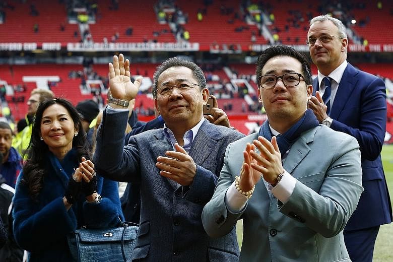 Leicester City's Thai owner Vichai Srivaddhanaprabha (centre) and his son Aiyawatt (right) acknowledging the club's fans at Old Trafford earlier this month.