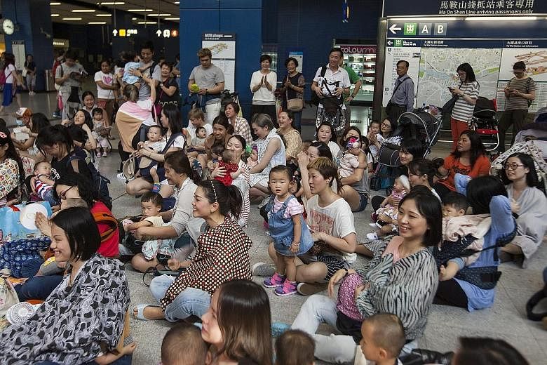 More than 100 nursing mothers took part in a breastfeeding flash mob inside Hong Kong's Tai Wai subway station yesterday. The activists were advocating for more public awareness on breastfeeding rights in the face of discouragement and prejudice agai
