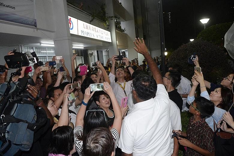 Mr Murali with residents and supporters outside the PAP branch office after being declared winner of the Bukit Batok by-election.