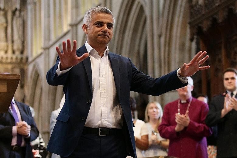 London's incoming mayor Sadiq Khan, who was the Labour candidate, at his swearing-in ceremony yesterday. His win was the sole consolation for the opposition party.