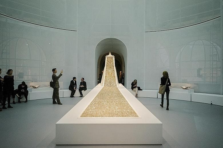 The train on a wedding dress (2014-15, above) by Karl Lagerfeld for Chanel.