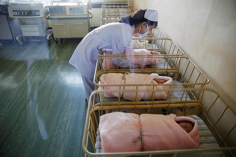 A nurse attending to babies at Pyongyang Maternity Hospital. The showpiece facility was shown to journalists on a rare media tour where officials escorted the press around.