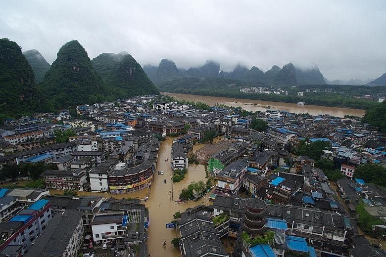 About 250 villagers and tourists are said to be trapped in the flood-hit Yangshuo county in Guangxi region. The area has experienced heavy flooding and massive blackouts after days of torrential rains.