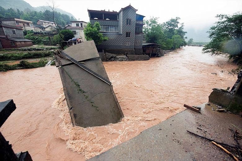 Torrential rain and flood waters caused this bridge to collapse in Guilin city in China's Guangxi Zhuang Autonomous Region yesterday. Heavy rain lashed much of southern and eastern China over the weekend, with Guangxi Zhuang among the hardest-hit are