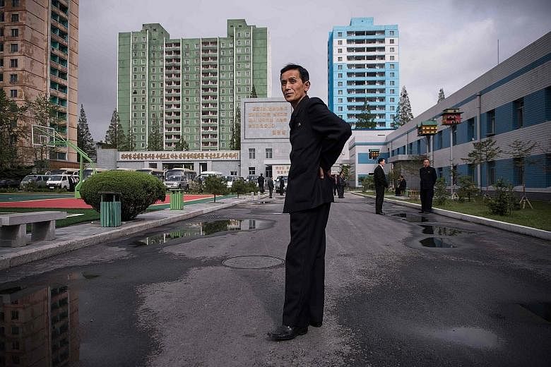 A North Korean minder at a factory in Pyongyang. Such minders chaperone foreign journalists on their trip to the state and may be telling government officials about anti-North Korean sentiment.