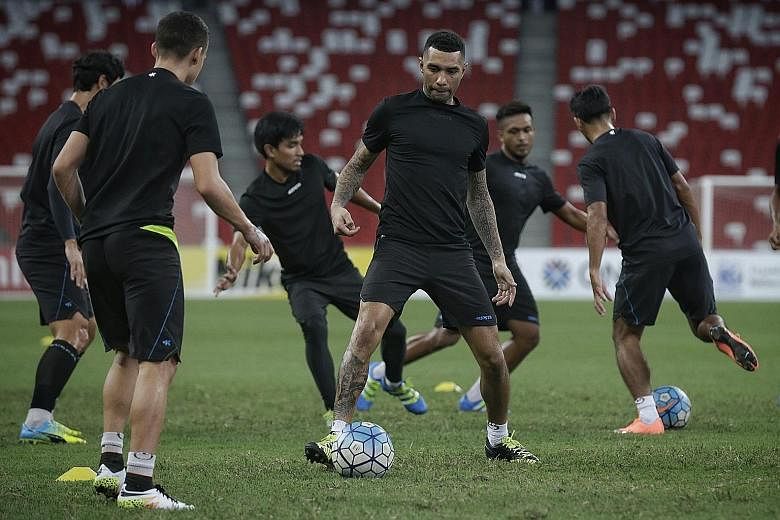 Jermaine Pennant (centre) training ahead of Tampines' AFC Cup clash against Selangor at the National Stadium tonight. The English winger has scored three goals for the Stags this season.
