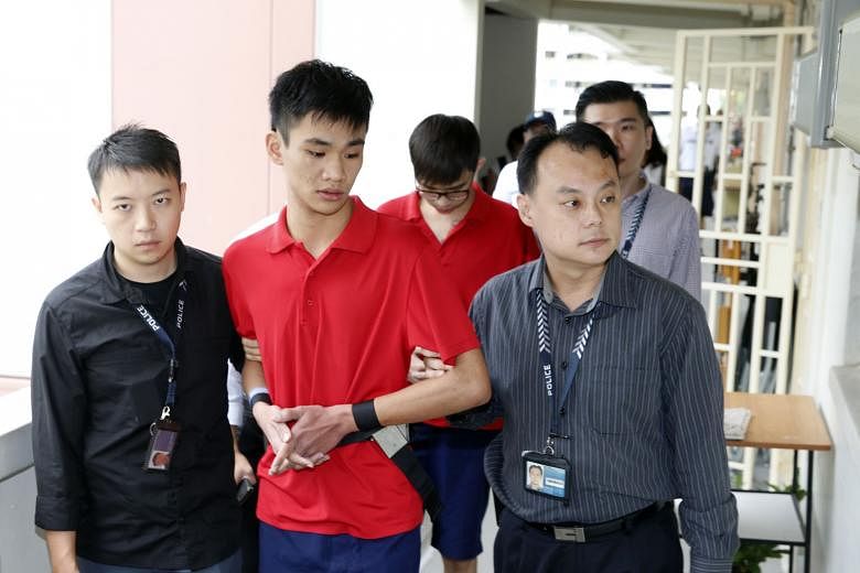 The suspects Chong (in front) and Sea being taken to the flat on the 10th floor of Block 59, Lengkok Bahru. The two are believed to be involved in other cases of loan shark harassment by fire reported in Hougang Street 51 and Sembawang Drive.