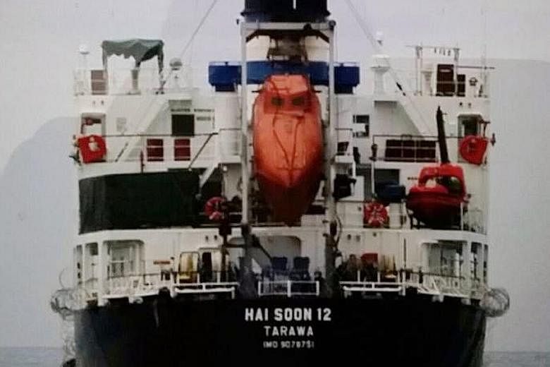 The MV Hai Soon 12 disappeared from radar in the Karimata Strait, said the Indonesian navy. The nine perpetrators (some seen above) climbed up the poop deck of the ship from a small boat in waters off Pulau Belitung.