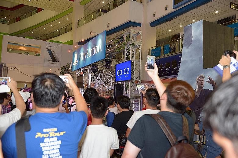 A countdown in more ways than one. As gaming enthusiasts count down to the launch of Uncharted 4 on Monday night, Funan DigitaLife Mall is also counting down to when its shutters fall for the last time in July. Freelance writer Darren Chew, 38 (left)