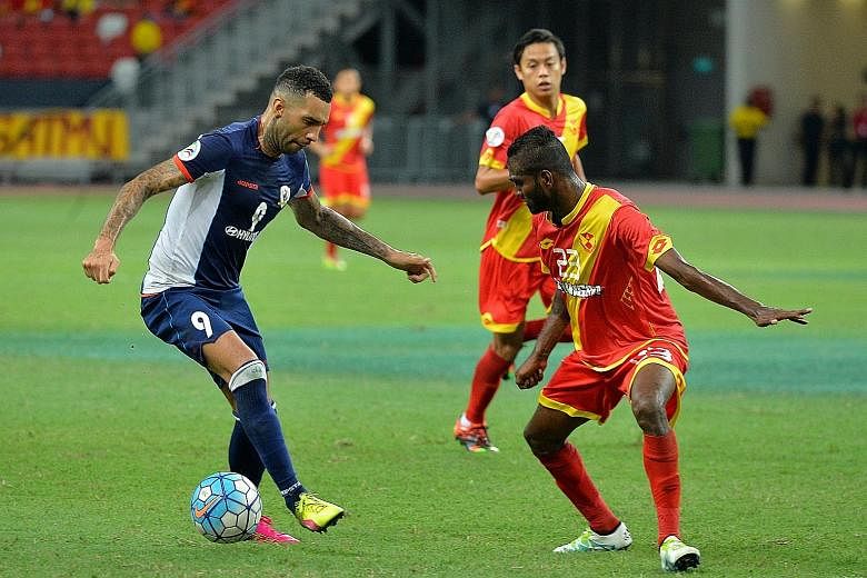 Jermaine Pennant of Tampines Rovers (left) eludes Selangor's Veenod Subramaniam during the 1-0 win in the Asian Football Confederation group-stage game yesterday.