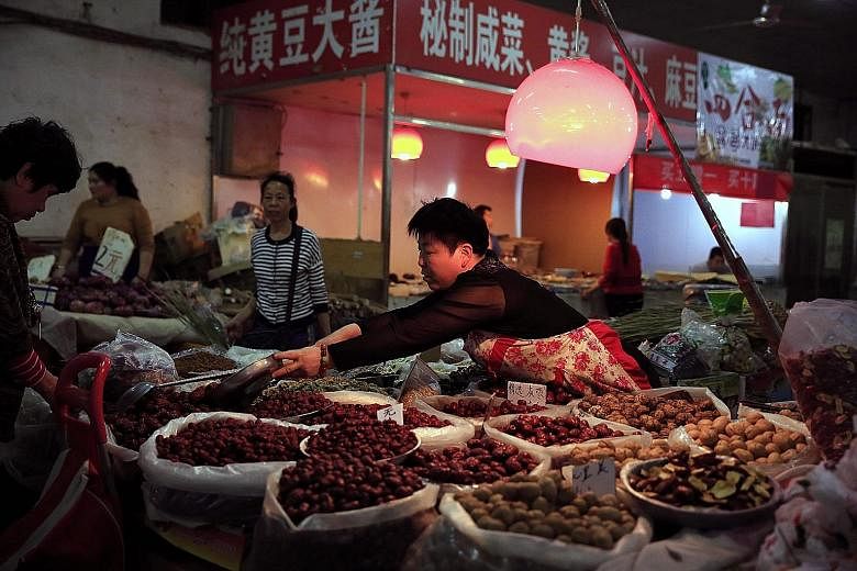 A market in Beijing. China's consumer price index rose 2.3 per cent in April from a year earlier, largely due to a spike in food prices, particularly pork.