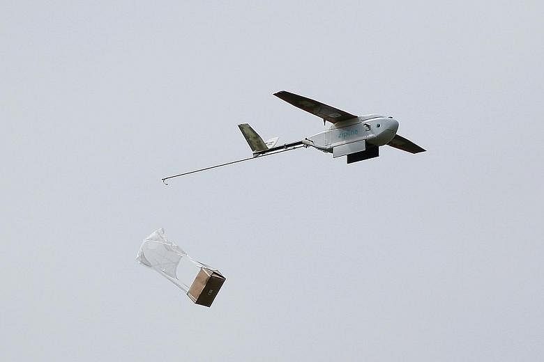 A delivery drone releasing its payload during a demonstration in San Francisco last week. PwC says drones will soon be boosting crop yields and delivering mail - among other tasks - in a business set to boom by more than 6,000 per cent by the end of 