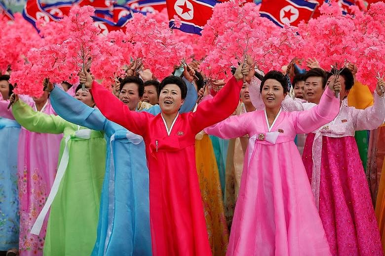 North Koreans at a mass rally and parade in Pyongyang's main ceremonial square yesterday, a day after the ruling party wrapped up its first congress in 36 years by elevating North Korean leader Kim Jong Un to party chairman.