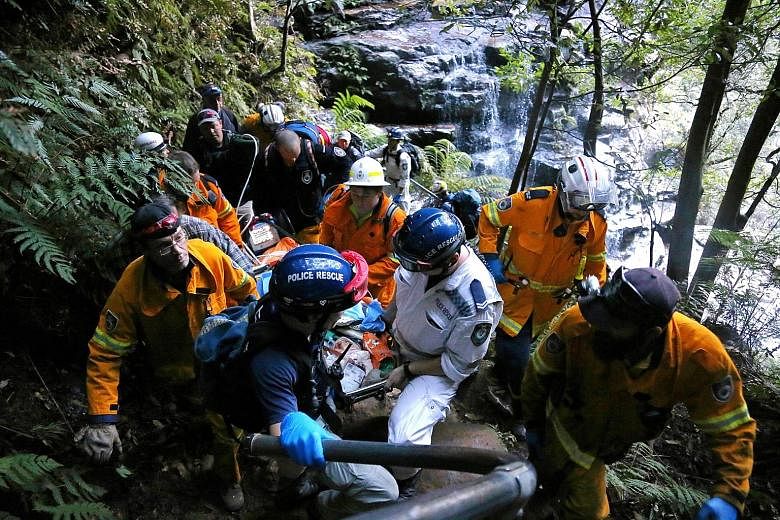 Rescuers carrying Ms Cheng away from the Empress Falls in the Blue Mountains National Park on Tuesday, after she slipped and fell more than 20m onto the rocks below. Ms Cheng (below) had head and chest injuries, and died yesterday morning.