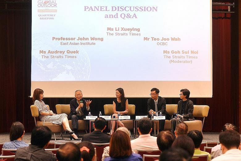 Prof Wong (second from left) speaking during the panel discussion yesterday. The other panellists were (from left) ST's foreign editor Audrey Quek, ST's senior regional correspondent Li Xueying and Mr Teo Joo Wah, chief strategist with OCBC Group's L