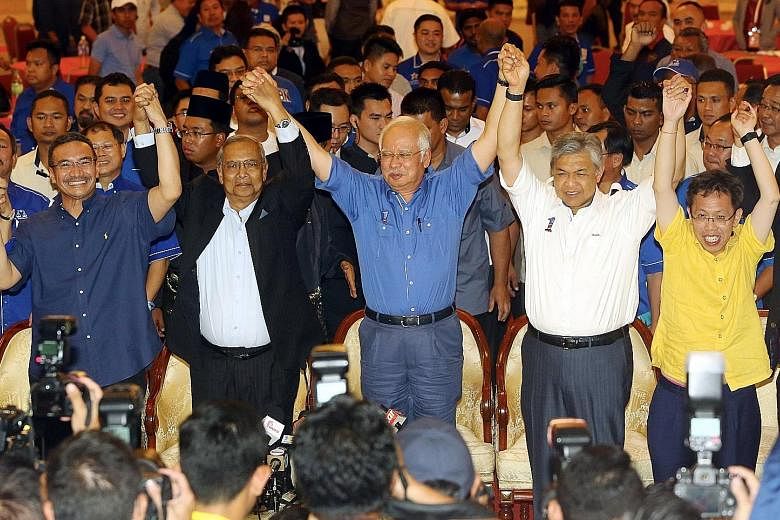 Prime Minister Najib (centre) celebrating the Sarawak election victory with Sarawak Chief Minister Adenan Satem (second from left), Deputy Prime Minister Ahmad Zahid Hamidi (second from right), Defence Minister Hishammuddin Hussein (far left) and Sar