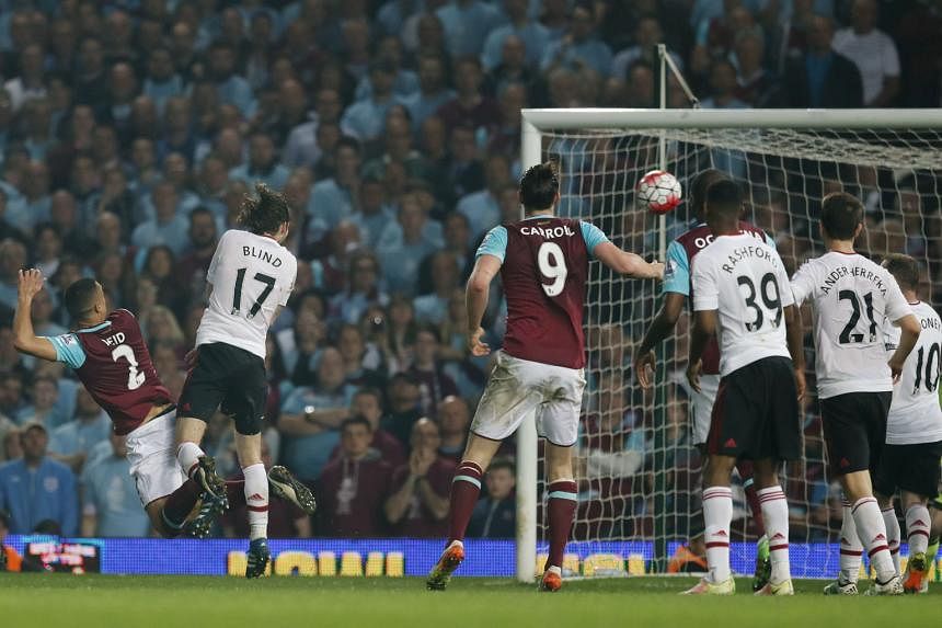 Winston Reid (left) scores the third goal for West Ham, sealing a 3-2 victory against Manchester United on Tuesday. It was the last goal to be scored at Upton Park.