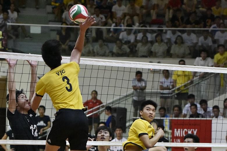 (Above)Victoria Junior College's Phoon Zhen Bang effecting a smash in the boys' final against Nanyang Junior College, who failed to wrest the title from VJC. 