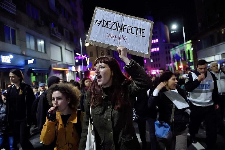 Protesters shouting anti-corruption slogans during a march last week in Bucharest. The protest was initiated on social media, following a journalistic inquiry that exposed the corruption in the Romanian health system. Tackling corruption is critical 