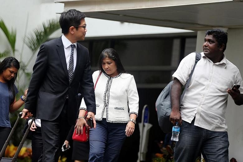 (From left) Gallop Stable's lawyer Simon Tan, owner Mani Shanker and operations director Thanabalan A. Rengasamy outside the court yesterday, the third day of the company's trial on a charge of animal cruelty.