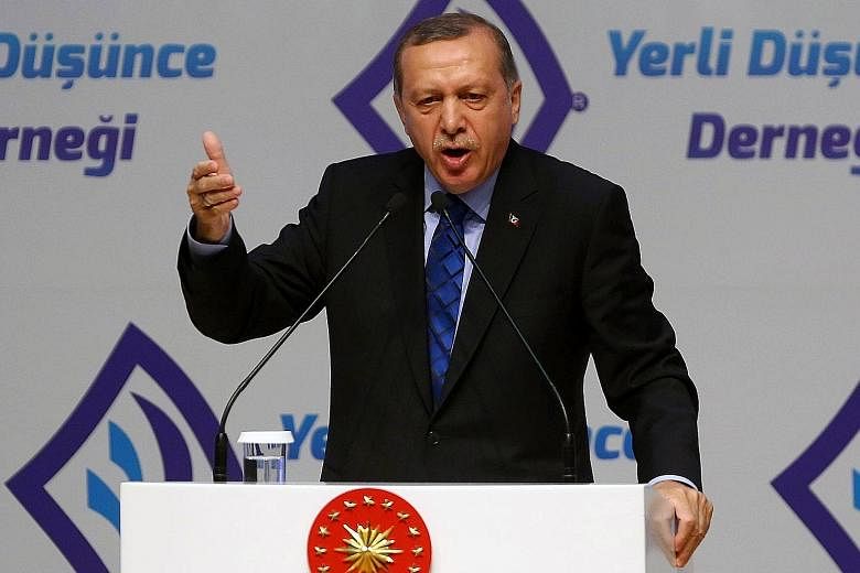Mr Erdogan speaking at an event in Ankara this week. The promise of visa-free travel is a key pillar of a March accord for Turkey to stem the flow of migrants to the EU, and that could now also be in peril.