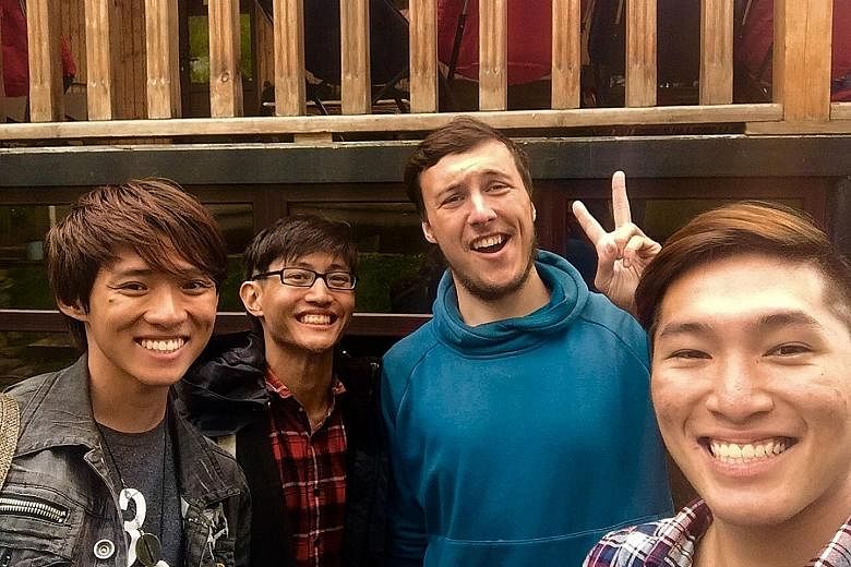 Three for the road: Singaporeans Boh Ze Kai (left), Jeremy Ng (second from left) and Atsushi Yamaguchi (far right) posing with their Russian friend Yuri. They were hiking in the mountains of Svaneti, Georgia.