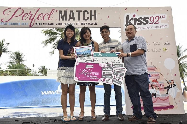 (From left) SilkAir representative Hazel Lee, Kiss92's Perfect Match couple Jae Teo and Janson Leong, and Mr Sim Hong Huat, general manager of SPH Radio at a prize presentation ceremony in Sentosa yesterday. The couple, both 27, beat two other couple